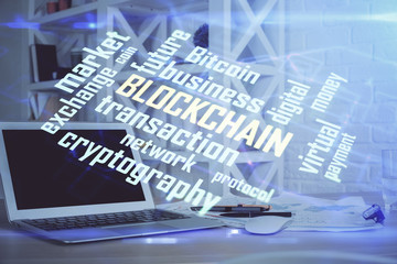 Double exposure of blockchain theme hologram and table with computer background. Concept of bitcoin...