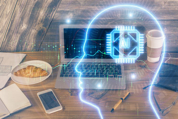 Multi exposure of work table with computer and brain hologram. Brainstorm concept.