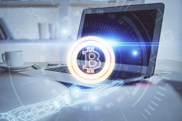 Multi exposure of blockchain theme hologram and table with computer background. Concept of bitcoin...