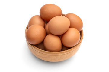Wooden bowl with eggs on white.