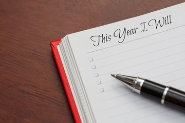 Conceptual,notebook on a wooden table. open diary and pen to record