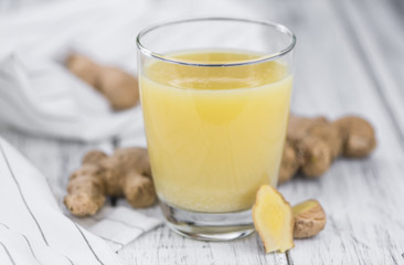 Some fresh Ginger Drink (selective focus; close-up shot)