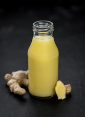 Some fresh Ginger Drink (selective focus; close-up shot)