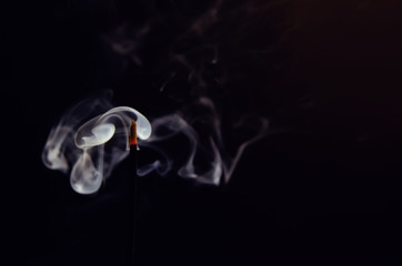 abstract background of smoke from a stick of incense close up with copy space