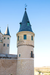 Fototapeta na wymiar Turret Of The Segovia Alcazar Against A Blue Sky