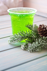 green fruit jelly on glass, vertical image