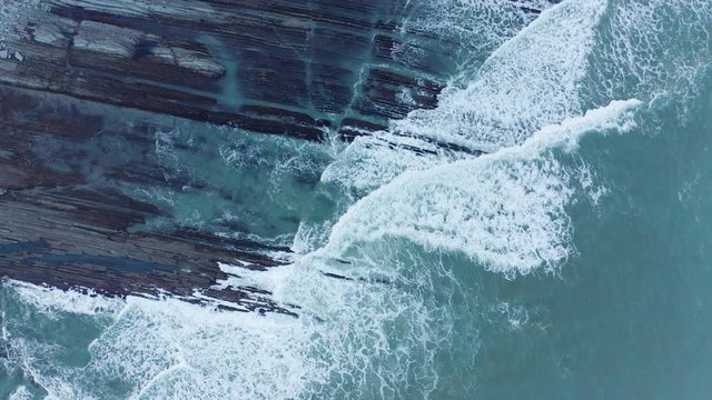 Zumaia and Deba flysch geological strata layers drone aerial view, Basque Country