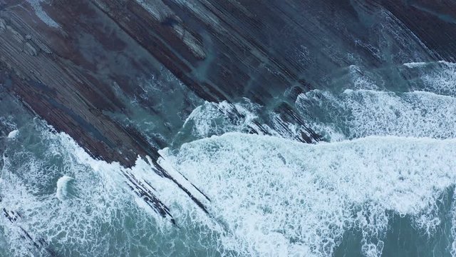 Zumaia and Deba flysch geological strata layers drone aerial view, Basque Country
