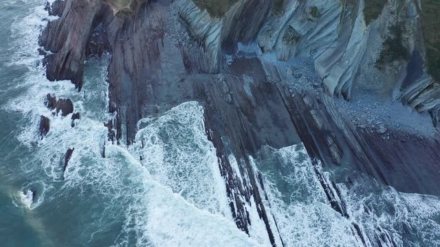 Zumaia and Deba flysch geological strata layers drone aerial view, Basque Country