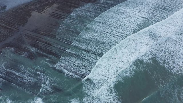 Zumaia and Deba flysch geological strata layers drone aerial view, Basque Country