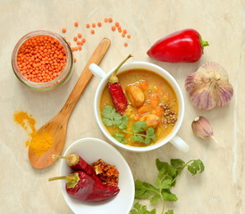 Dal, red lentil soup with turmeric, garlic, chili and cilantro. Indian food,  top view 