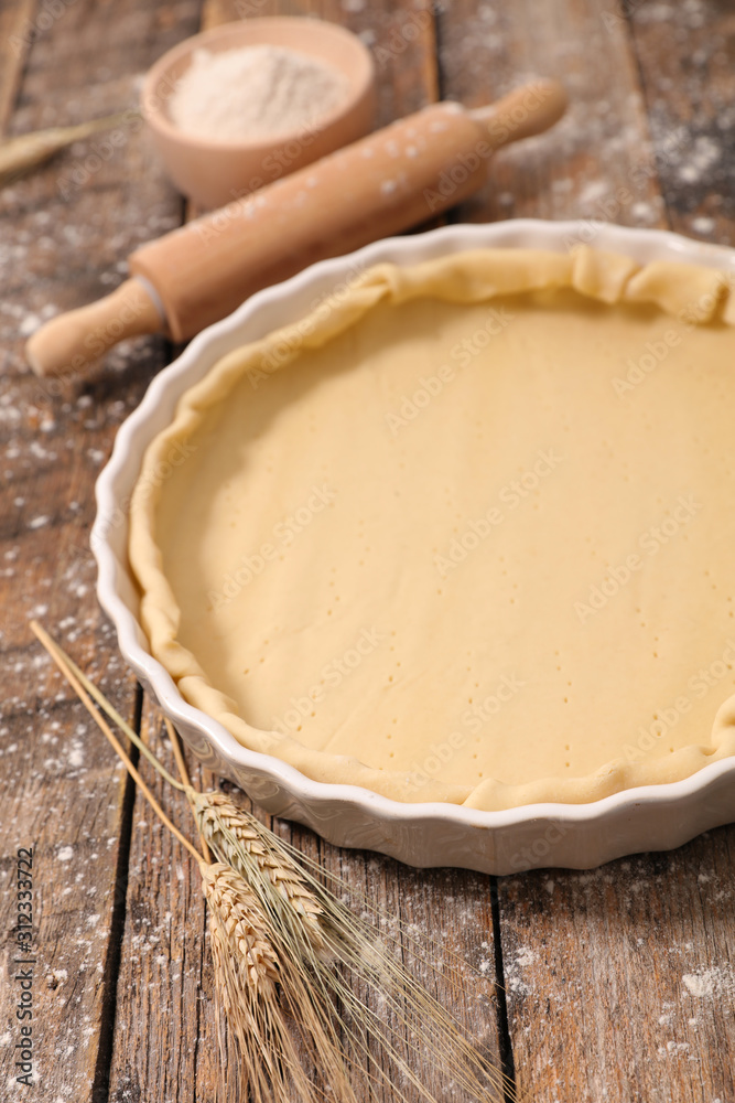 Wall mural raw dough with rolling pin and flour