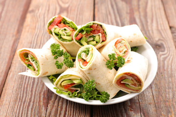 sandwich wrap with avocado, lettuce and tomato