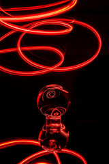 abstract red light trails with lens ball