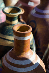 Mexican ceramic pots with tall necks in market at Old Town