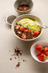 Smoothie bowl with granola and strawberry, healthy breakfast