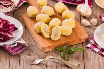 Potato gnocchi stuffed with radicchio and ricotta.	