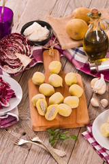 Potato gnocchi stuffed with radicchio and ricotta.	