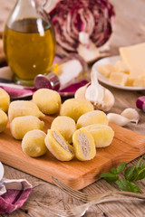 Potato gnocchi stuffed with radicchio and ricotta.	