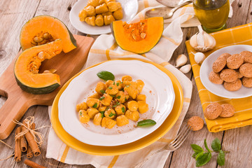 Pumpkin gnocchi with grated amaretti cookies.	