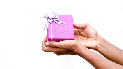 Hands holding gift box isolated on white background.