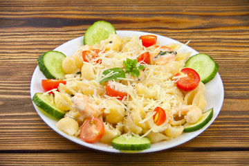delicious delicious spaghetti with shrimps and basil on  plate