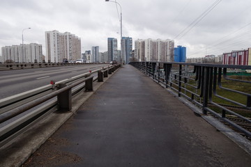 high-rise housing over a bridge in moscow butyrski district on overcast day