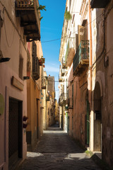 Narrow old street of two-storied houses in Procida Italy