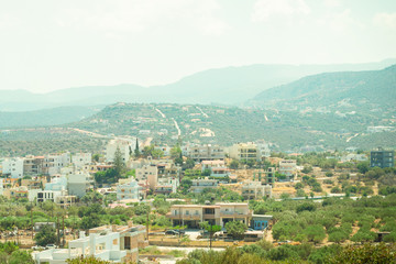 Fototapeta na wymiar greek town island crete sunny day on the background hill base postcard