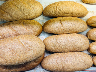 lots of baked fresh bread for eating on the table as the background
