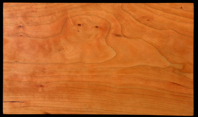 Close-up of hand finished cherry wood with a nice grain pattern