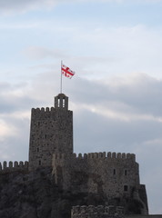 Georgian flag waving over the Rabati Fortress. Georgia Akhaltsikhe, December 2019.