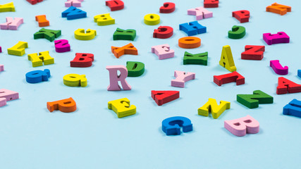 Multicolored letters on a blue background.