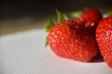 Fresh isolated strawberry on the table