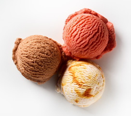 Three different flavored scoops of ice cream