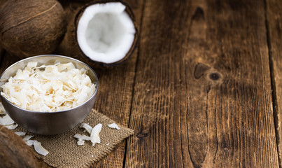 Obraz na płótnie Canvas Portion of Coconut Chips as detailed close-up shot; selective focus