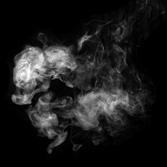 Obraz na płótnie Canvas Photo of white smoke isolated on a black background