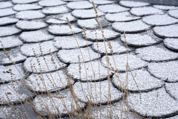 Roof tiles. Winter roof background with snow on it