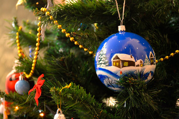 Christmas tree decoration with decorative balls, gold beads and other toys