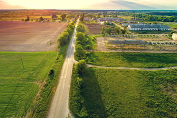 Aerial view of the countryside. The direct country road along the field