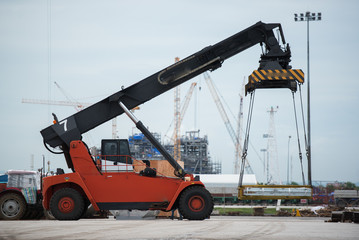 Forklift loading the  on construction site.