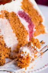 Beautiful and delicious dessert. The cake on the stand is decorated with red and yellow pears.