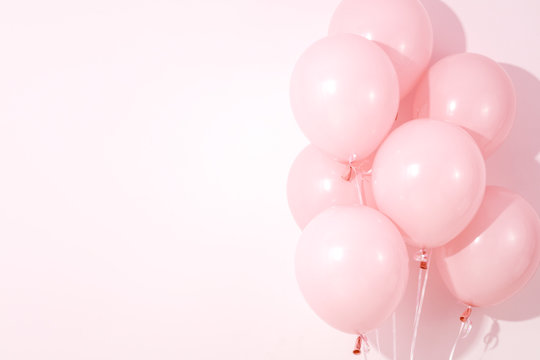 Balloons on pink background