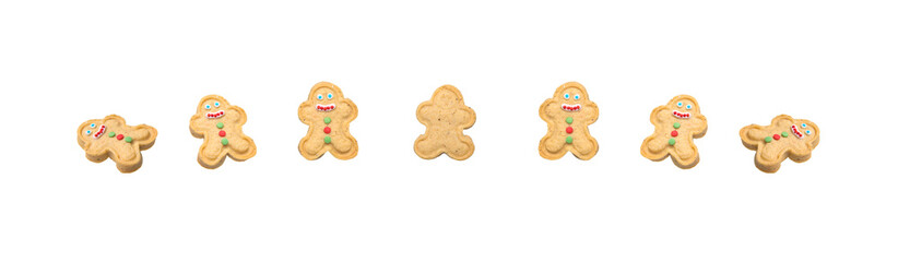 on a white background, sweet cookies in the shape of a snowman, with icing and colorful dragees, are laid out in a row