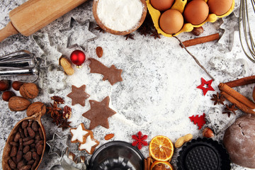 Fototapeta na wymiar Baking christmas cookies. Typical cinnamon stars bakery with spices. xmas decoration on table