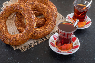 Traditional Turkish bagel simit on the table with black background