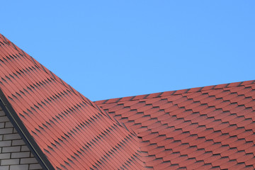 Decorative metal tile on a roof