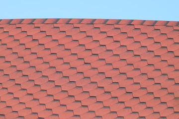 Decorative metal tile on a roof
