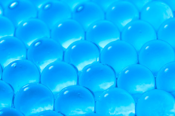 Fototapeta premium Texture of blue gel balls with blur