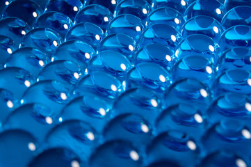 Obraz premium Texture of blue gel balls with blur